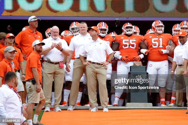 Clemson Tigers head coach Dabo Swinney and stands on the hill next to Howards Rock before leading his team onto the field for the ACC college...