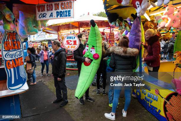 Visitor holds on to a prize banana toy at Nottingham Goose Fair in the Forest Recreation Ground on October 7, 2017 in Nottingham, England. The annual...