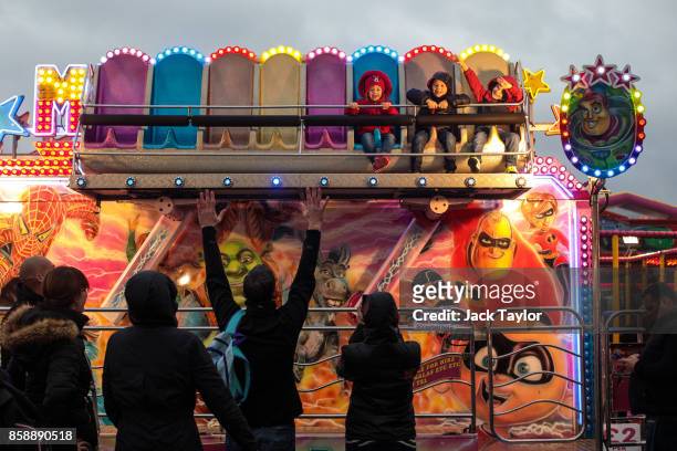 Young visitors enjoy a ride at the Nottingham Goose Fair in the Forest Recreation Ground on October 7, 2017 in Nottingham, England. The annual goose...