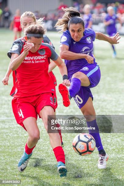 Orlando Pride forward Marta takes a shot blocked by Portland Throns defender Emily Menges during the play offs semifinals between the Portland Thorns...