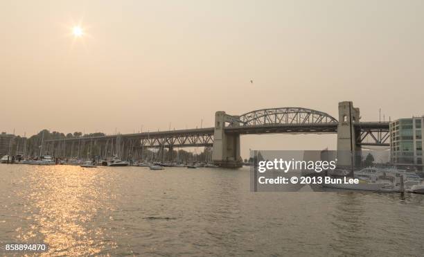 burrard bridge at sunset time - smog sky stock pictures, royalty-free photos & images