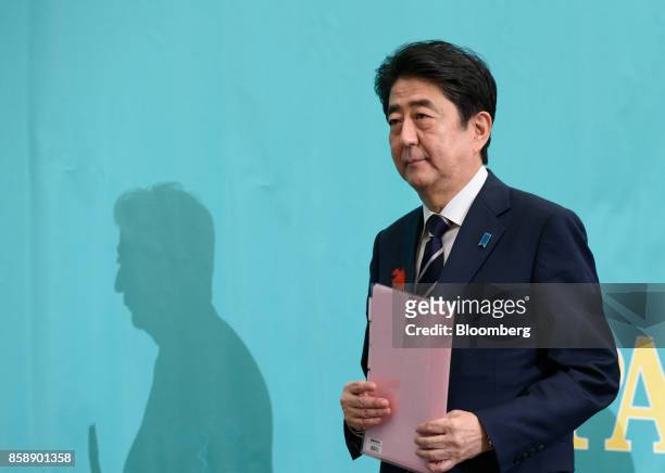Shinzo Abe, Japan's prime minister and president of the Liberal Democratic Party , leaves following a debate with other party leaders ahead of the...