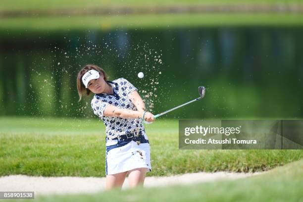 Hiroko Azuma of Japan hits from a bunker on the 8th hole during the final round of Stanley Ladies Golf Tournament at the Tomei Country Club on...