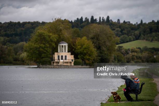 Dog walkers on the River Thames next to Temple Island in British Prime Minister Theresa May's constituency of Maidenhead on October 7, 2017 in...