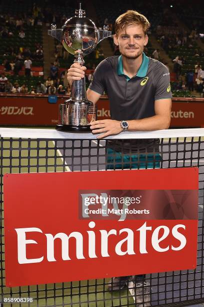 David Goffin of Belgium poses with the winners trophy after his men's final match against Adrian Mannarino of France during day seven of the Rakuten...