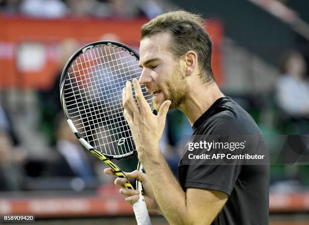 Adrian Mannarino of France reacts after losing a point against David Goffin of Belgium during their men's singles final match of the Japan Open...