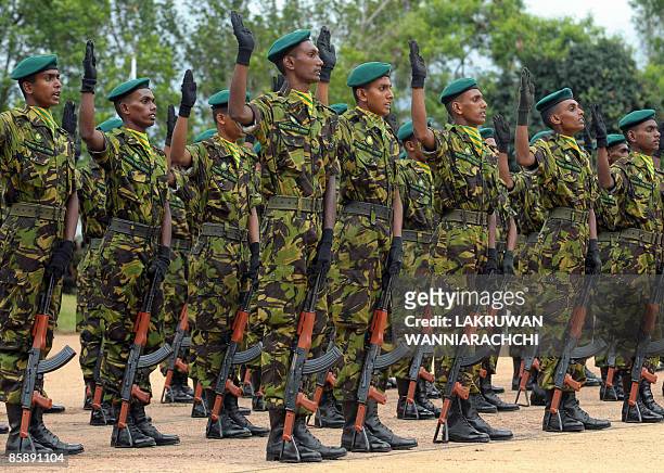Sri Lankan Police Special Task Force commandos recite an oath during a passing out ceremony in Katukurunda, some 43 kms south of Colombo, on April...