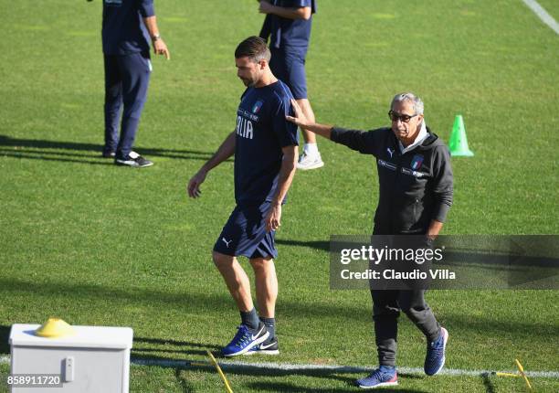 Italy Doctor Enrico Castellacci and Andrea Barzagli of Italy chat prior to the Italy training session at Sisport Mirafiori on October 8, 2017 in...