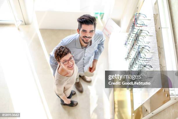 couple in eyewear store - reading glasses top view stock pictures, royalty-free photos & images
