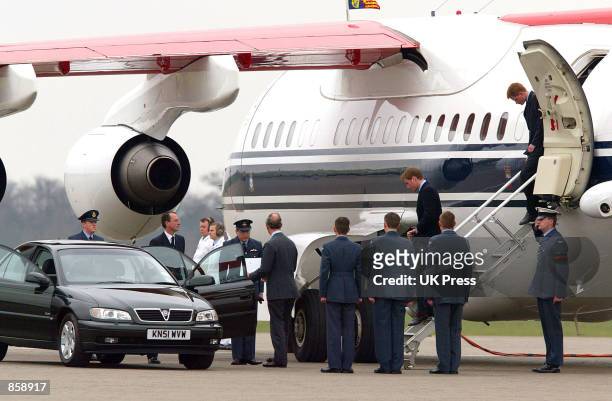 Prince Charles, Prince Harry and Prince William arrive March 31, 2002 at Northolt Air Force Base, England after cutting short a holiday in Klosters,...