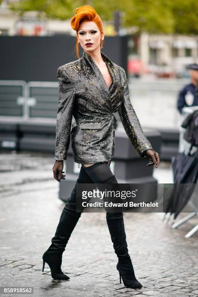 Guest wears a blazer jacket, black thigh high boots, has red hair, and attends Le Defile L'Oreal Paris as part of Paris Fashion Week Womenswear...