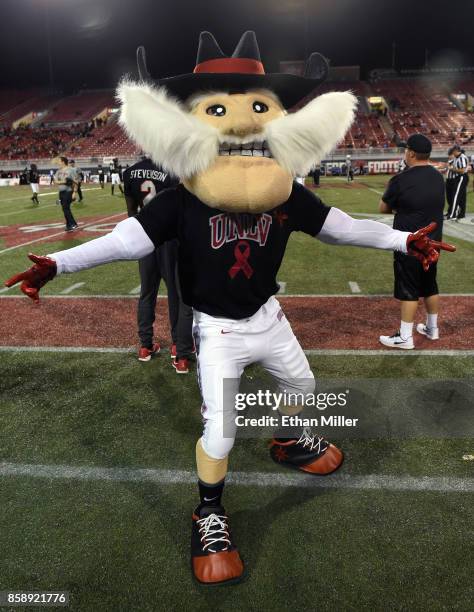 Mascot Hey Reb wears a shirt with a ribbon on it before the team's game against the San Diego State Aztecs at Sam Boyd Stadium on October 7, 2017 in...