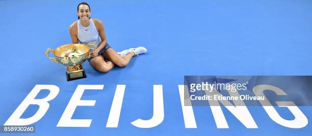 Caroline Garcia of France poses with the winners trophy after winning the Women's Singles final against Simona Halep of Romania on day nine of the...