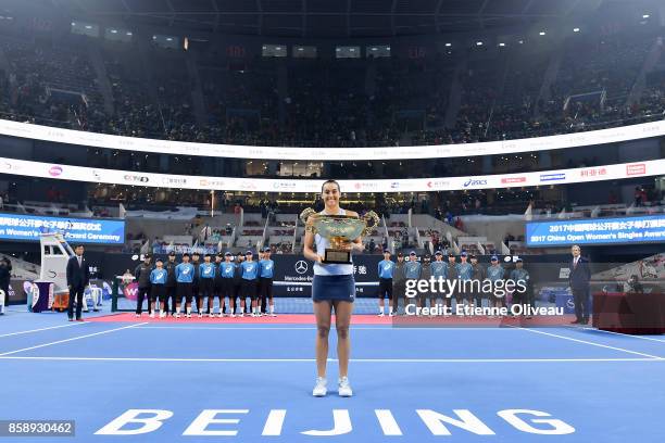 Caroline Garcia of France poses with the winners trophy after winning the Women's Singles final against Simona Halep of Romania on day nine of the...