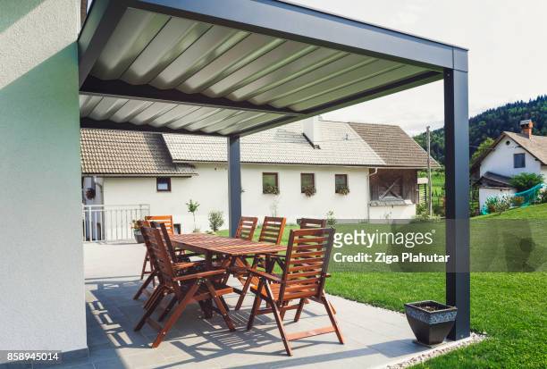 back yard terrace with table and chairs - door canopy stock pictures, royalty-free photos & images