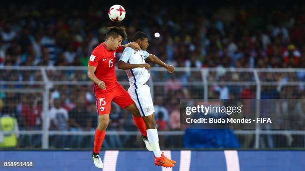 Sebastian Valencia of Chile battles for the ball with Rhian Brewster of England during the FIFA U-17 World Cup India 2017 group F match between Chile...