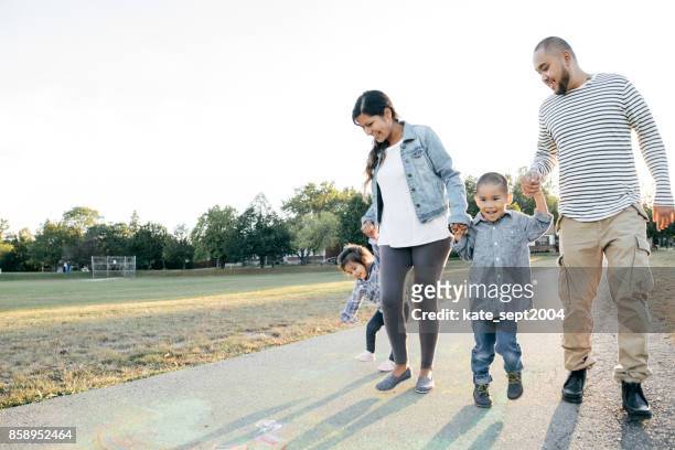 family of four - immigration stock pictures, royalty-free photos & images