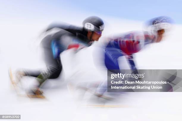 Kazuki Yoshinaga of Japan and Semen Elistratov of Russia compete in the Mens 1000m Quarter Finals during the Audi ISU World Cup Short Track Speed...