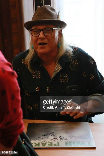 Actor Michael Horse, who portrayed the character of Deputy Hawk in the TV show Twin Peaks, talks to a fan and signs a Twin Peaks soundtrack vinyl...