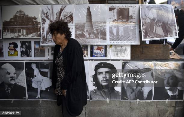 Poster with the photograph of the legendary Argentine-born guerrilla leader Ernesto "Che" Guevara displayed for sale along with other posters...