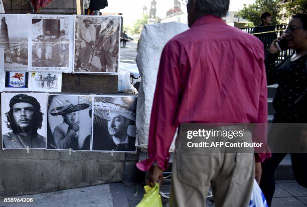 Poster with the photograph of the legendary Argentine-born guerrilla leader Ernesto "Che" Guevara displayed for sale along with other posters...
