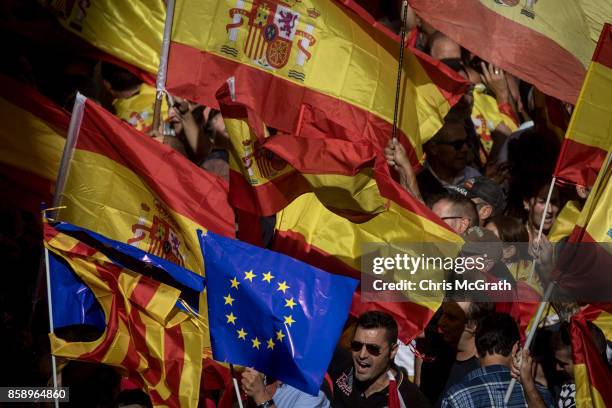 Thousands of demonstrators march during a protest against Catalonia's indepedence on October 8, 2017 in Barcelona, Spain. Large numbers of citizens...