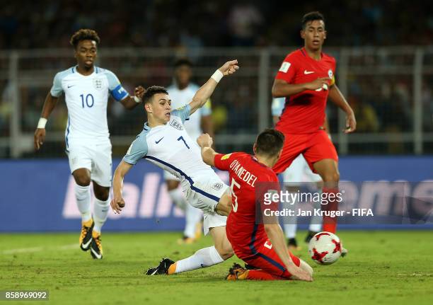 Philip Foden of England takes a shot at goal under pressure from Yerco Oyanedel of Chile during the FIFA U-17 World Cup India 2017 group F match...