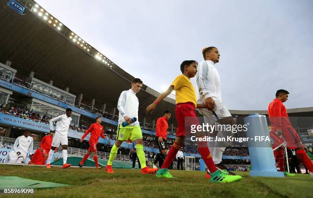 The captains lead their teams out during the FIFA U-17 World Cup India 2017 group F match between Chile and England at Vivekananda Yuba Bharati...