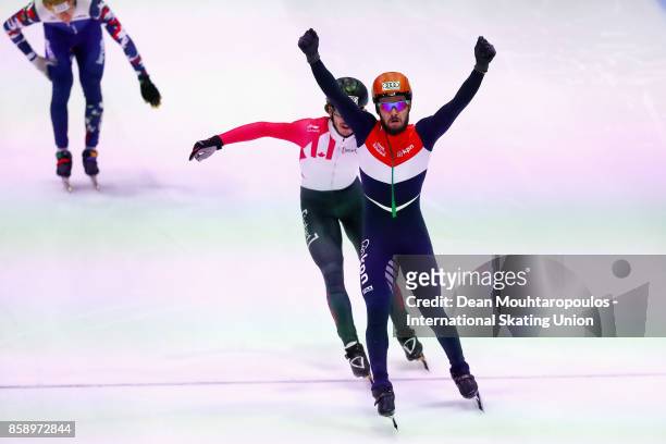 Sjinkie Knegt of the Netherlands celebrates crossing the finish line and winning the Mens 1000m Final during the Audi ISU World Cup Short Track Speed...