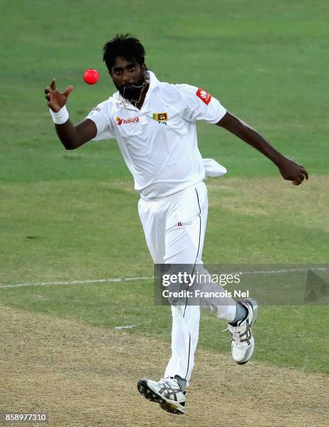 Nuwan Pradeep of Sri Lanka stops the ball during Day Three of the Second Test between Pakistan and Sri Lanka at Dubai International Cricket Ground on...