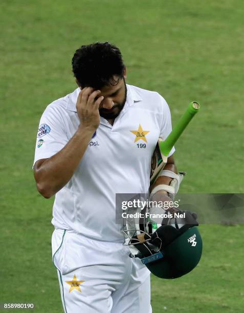 Azher Ali leaves the field after being dismissed by Rangana Herath of Sri Lanka during Day Three of the Second Test between Pakistan and Sri Lanka at...