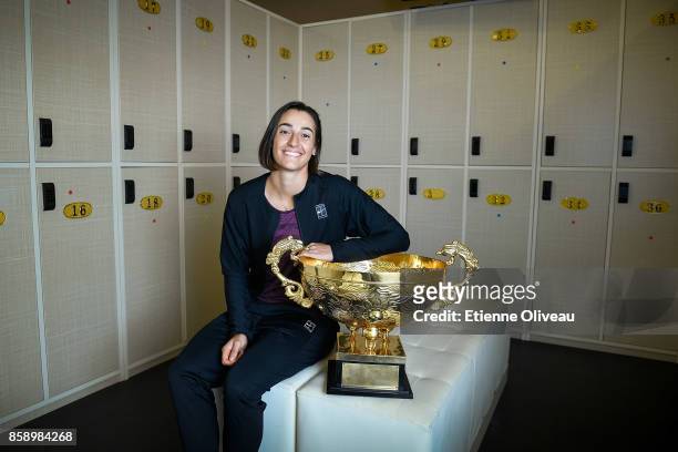Caroline Garcia of France poses for a picture in the locker room with the winner's trophy after winning the Women's Singles final against Simona...