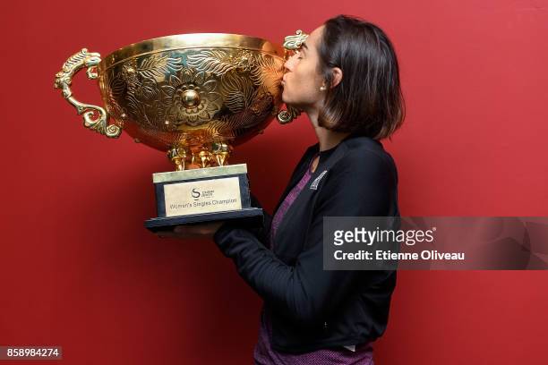 Caroline Garcia of France holds the winner's trophy after winning the Women's Singles final against Simona Halep of Romania on day nine of the 2017...