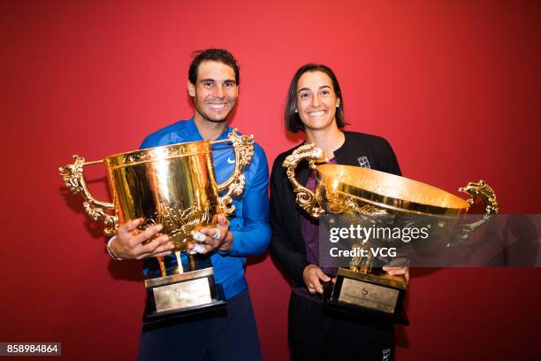 Rafael Nadal of Spain and Caroline Garcia of France pose with their trophies for a picture after the final matches on day nine of 2017 China Open at...