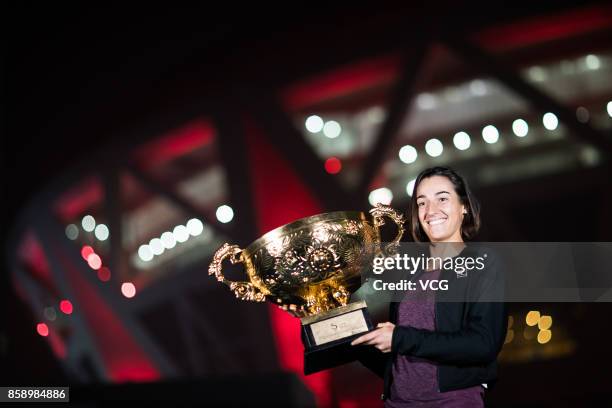 Caroline Garcia of France poses with her trophy for a picture after winning the Women's singles final match against Simona Halep of Romania on day...