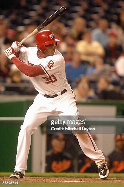 Justin Maxwell of the Washington Nationals prepares to take a swing during an exbition baseball game against the Baltimore Orioles on April 4, 2009...
