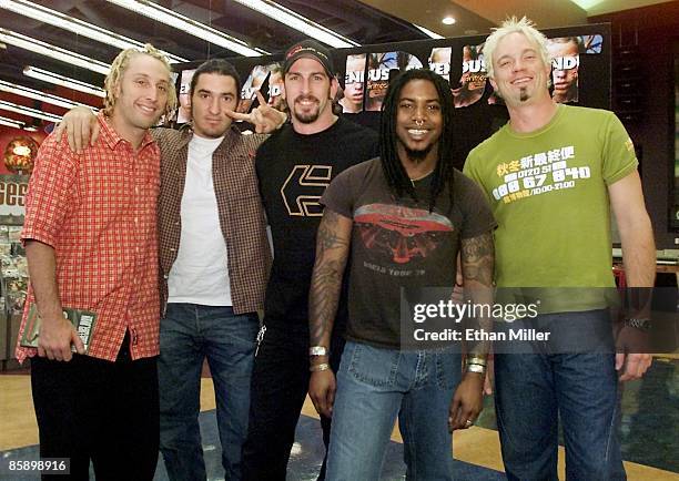 Sevendust drummer Morgan Rose, guitarists Clint Lowery and John Connolly, singer Lajon Witherspoon and bassist Vince Hornsby appear at the Wow! store...