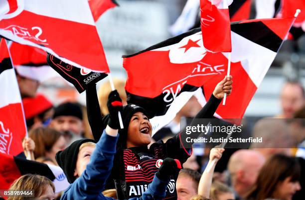 Young Saracens fan celebrates a try during the Aviva Premiership match between Saracens and Wasps at Allianz Park on October 8, 2017 in Barnet,...