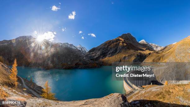 concrete dam wall of grossglockner - margaritze  stausee - hohe tauern stock pictures, royalty-free photos & images