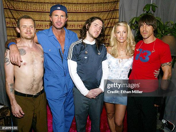 Leslie Prekop of Nevada poses with the rock band Red Hot Chili Peppers bassist Flea, drummer Chad Smith, guitarist John Frusciante and singer Anthony...