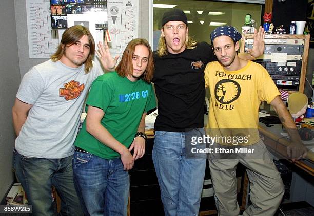Rock band Puddle of Mudd drummer Greg Upchurch, guitarist Paul Phillips, frontman Wesley Scantlin and bassist Doug Ardito appear at KXTE Xtreme Radio...