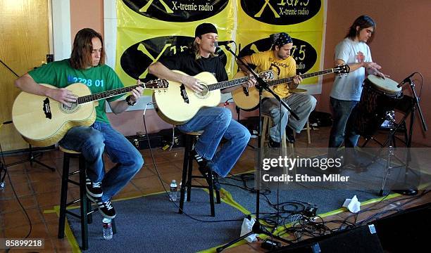 Rock band Puddle of Mudd guitarist Paul Phillips, frontman Wesley Scantlin, bassist Doug Ardito and drummer Greg Upchurch, perform an acoustic set on...