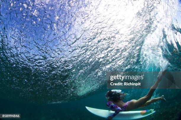beauty under a wave - surfer under wave stock pictures, royalty-free photos & images