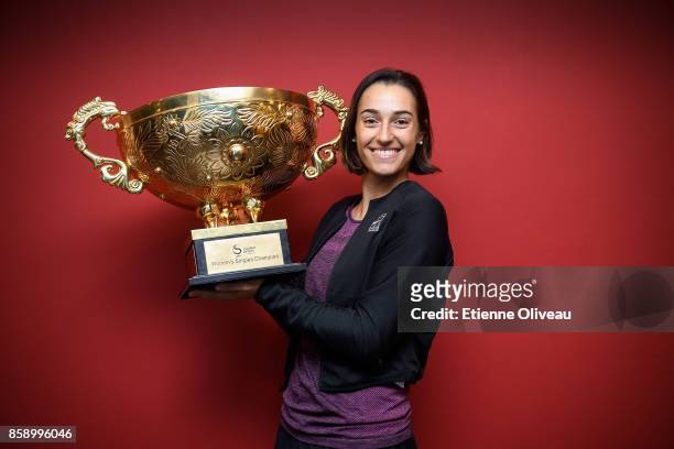 Caroline Garcia of France poses for a picture with the winners trophy after winning the Women's Singles final against Simona Halep of Romania on day...