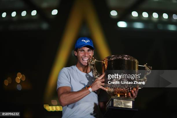 Rafael Nadal of Spain hold the winners trophy poses for a picture after winning the Men's Singles final against Nick Kyrgios of Australia on day nine...
