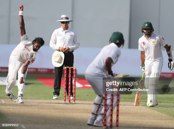 Sri Lanka's Numan Pradeep bowls during the third day of the second Test cricket match between Sri Lanka and Pakistan at Dubai International Stadium...