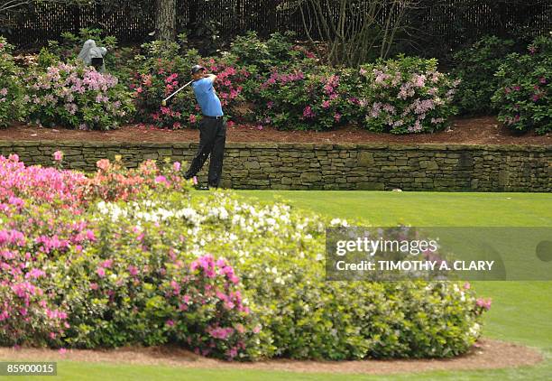 Tiger Woods of the US tees off on the thirteenth hole during the second round of the US Masters at the Augusta National Golf Club on April 10, 2009....