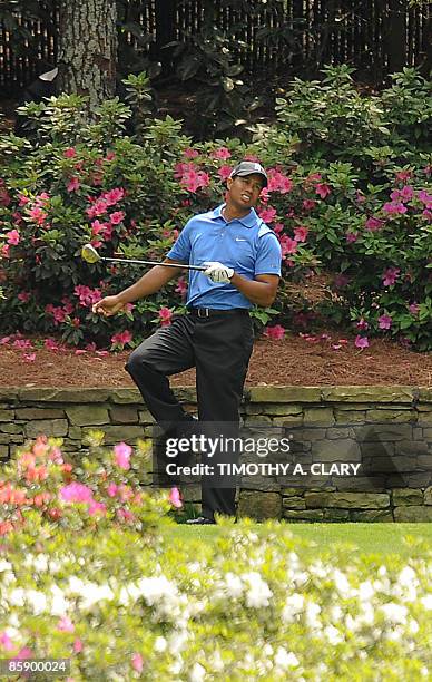 Tiger Woods of the US reacts to his tee shot on the thirteenth hole during the second round of the US Masters at the Augusta National Golf Club on...