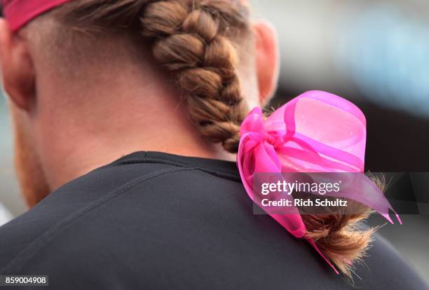 Beau Allen of the Philadelphia Eagles has a pink bow at the bottom of his pony tail before a game against the Arizona Cardinals at Lincoln Financial...