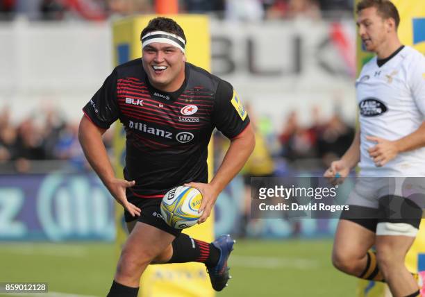 Jamie George of Saracens celebrates after scoring his first try of three during the Aviva Premiership match between Saracens and Wasps at Allianz...